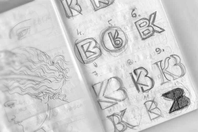 Notebook Sketch Logo Mockup by GraphicsFamily